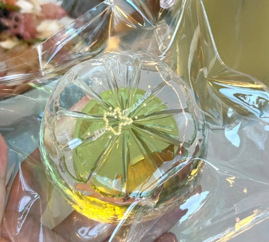 Clear silicone squishy with Chiboki crystal bottle design, green liquid inside, stress-relief toy by lovesquishy