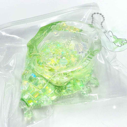 
Holographic Glitter Seashell Squishy: Handcrafted Stress Relief